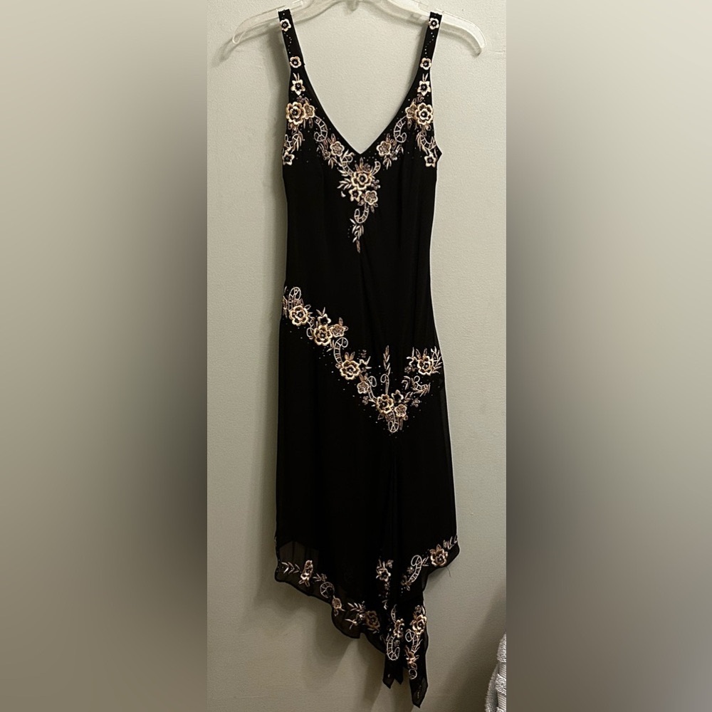 Gorgeous sleeveless black dress with gold accents and beadwork